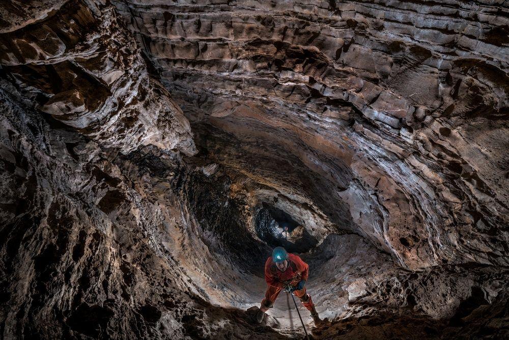 PESH-2019-expedition-looking-down-a-cavern