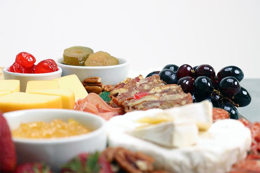 DeLuxe Fruitcake, Fruit, Meat, & Cheese Tray Close Up